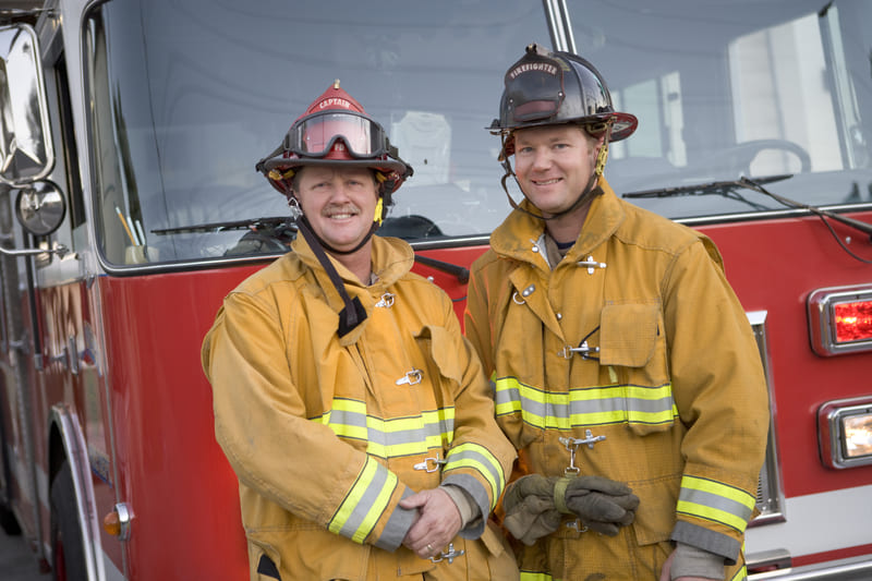 fire-fighter-1-portrait-of-two-firefighters-by-a-fire-engine