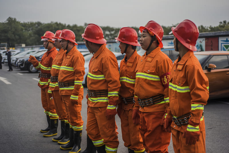 fire-fighter-1-standing-in-a-row-of-firefighters