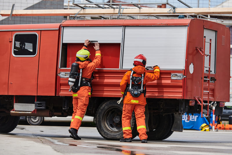 fire-fighting-course-firefighter-team-training-with-various-tools-in-professional-gear