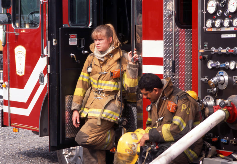 fire-fighting-course-two-firefighters-take-a-break-after-fighting-a-house-fire