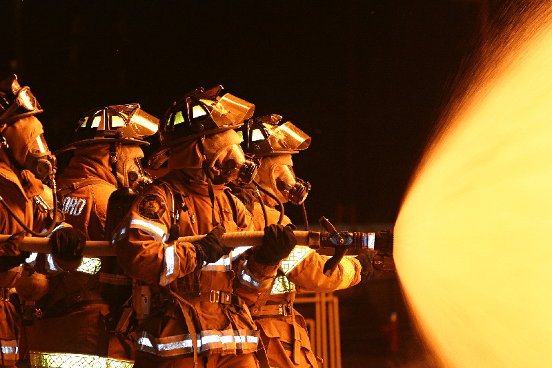 fire-fighting-training-team-spraying-hose