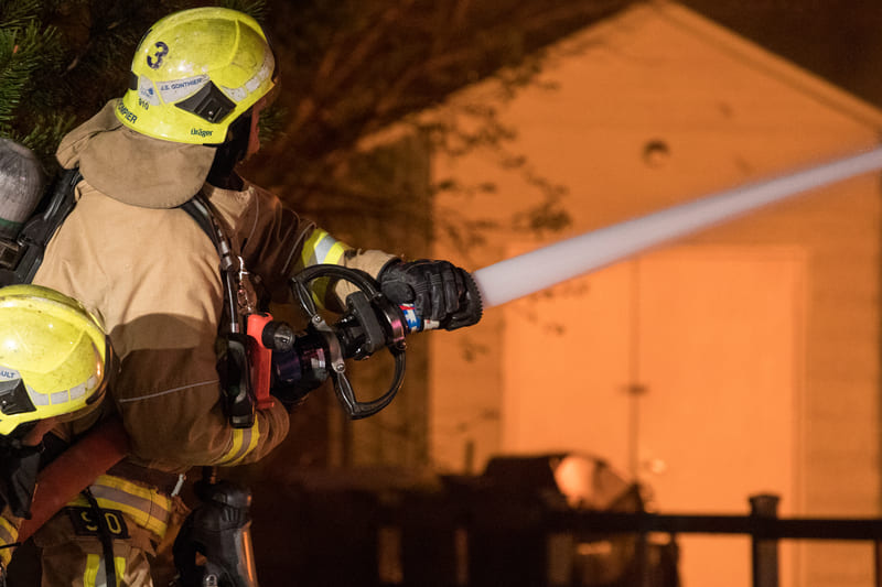 firefighting-training-firefighter-spray-water-on-house-fire