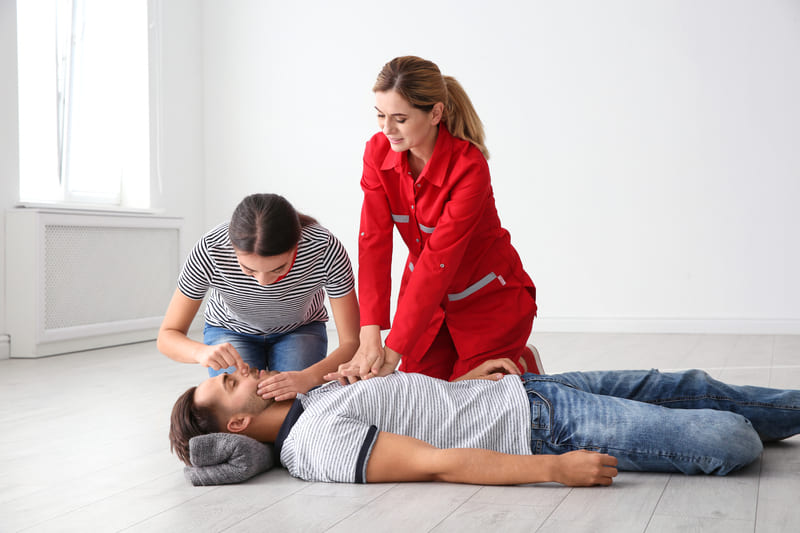 first-aid-course-woman-about-to-begin-mouth-to-mouth