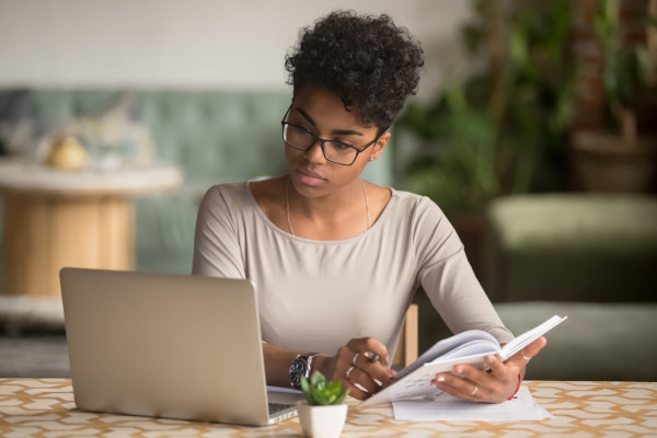 health-and-safety-courses-woman-researching on laptop