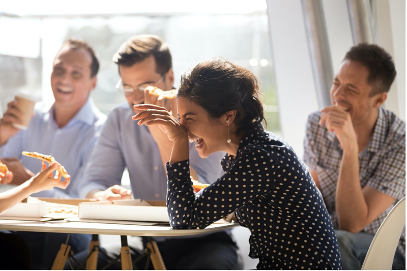 Health-and-safety-training-woman-laughing-pizza