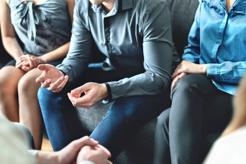 safety-officer-course-counseling-and-conversation-in-group-therapy-or-meeting-man-sharing-story