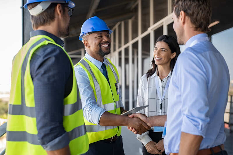 safety-officer-course-engineer-and-businessman-handshake-at-construction-site