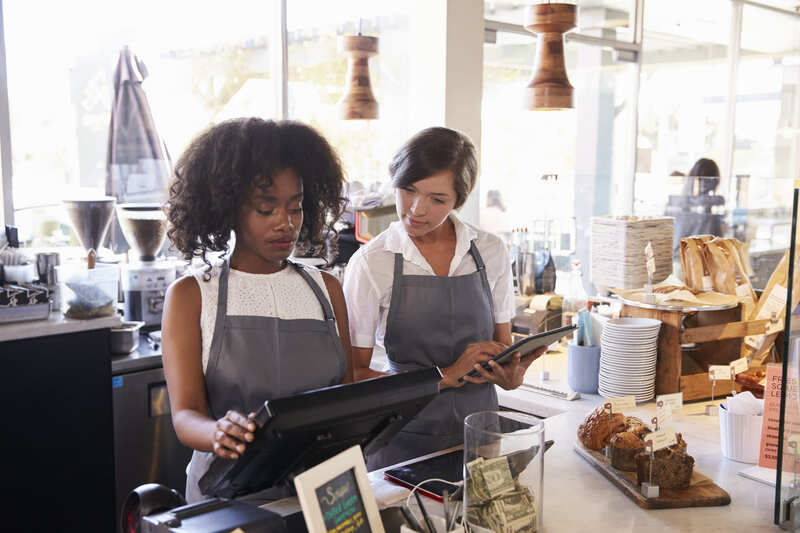 safety-officer-course-new-employee-receives-training-at-delicatessen-checkout