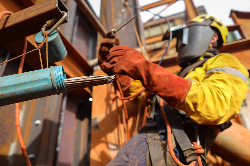 safety-officer-course-rope-access-welder-abseiler-wearing-fall-prevention-safety-body-harness-welding-helmet-protective-gear-inspecting-preparing