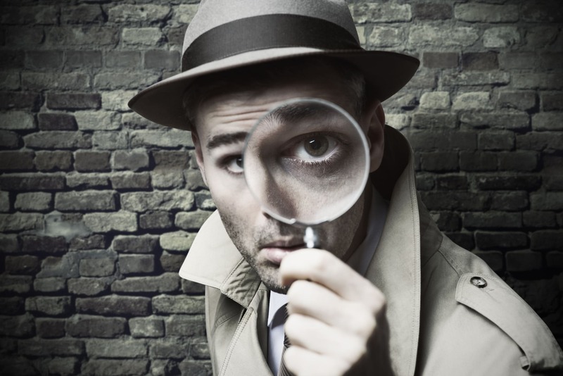 safety-officer-course-vintage-detective-looking-through-a-magnifier