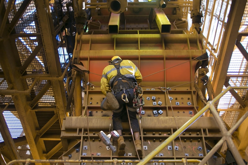 saftey-officer-course-male-rope-access-industry-worker-wearing-safety-harness-fall-protection-helmet-hanging-working-on-y-hang-rope-position