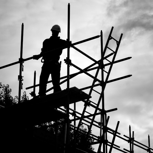 working-at-heights-training-silhouette-construction-worker-on-scaffolding-building-site-48618093