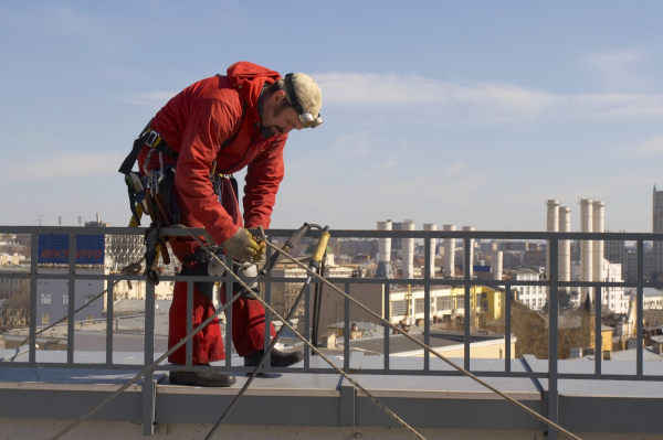 working-from-heights-course-man-on-roof-red-jumpsuit