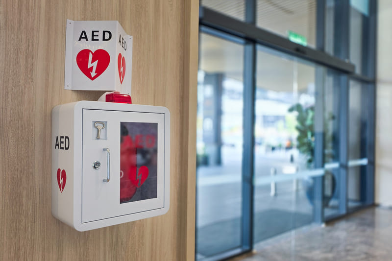 first-aid-training-automated-external-defibrillator-installed-on-wall-in-hotel-lobby-as-first-aid-in-heart-attack-situation