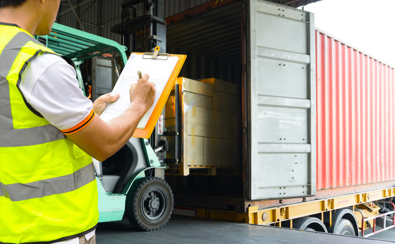 safety-officer-course-warehouse-worker-holding-clipboards-control-forklift-loading-shipment-goods-into-container-truck