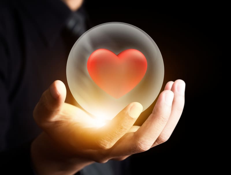 first-aid-training-hand-holding-red-heart-in-crystal-ball